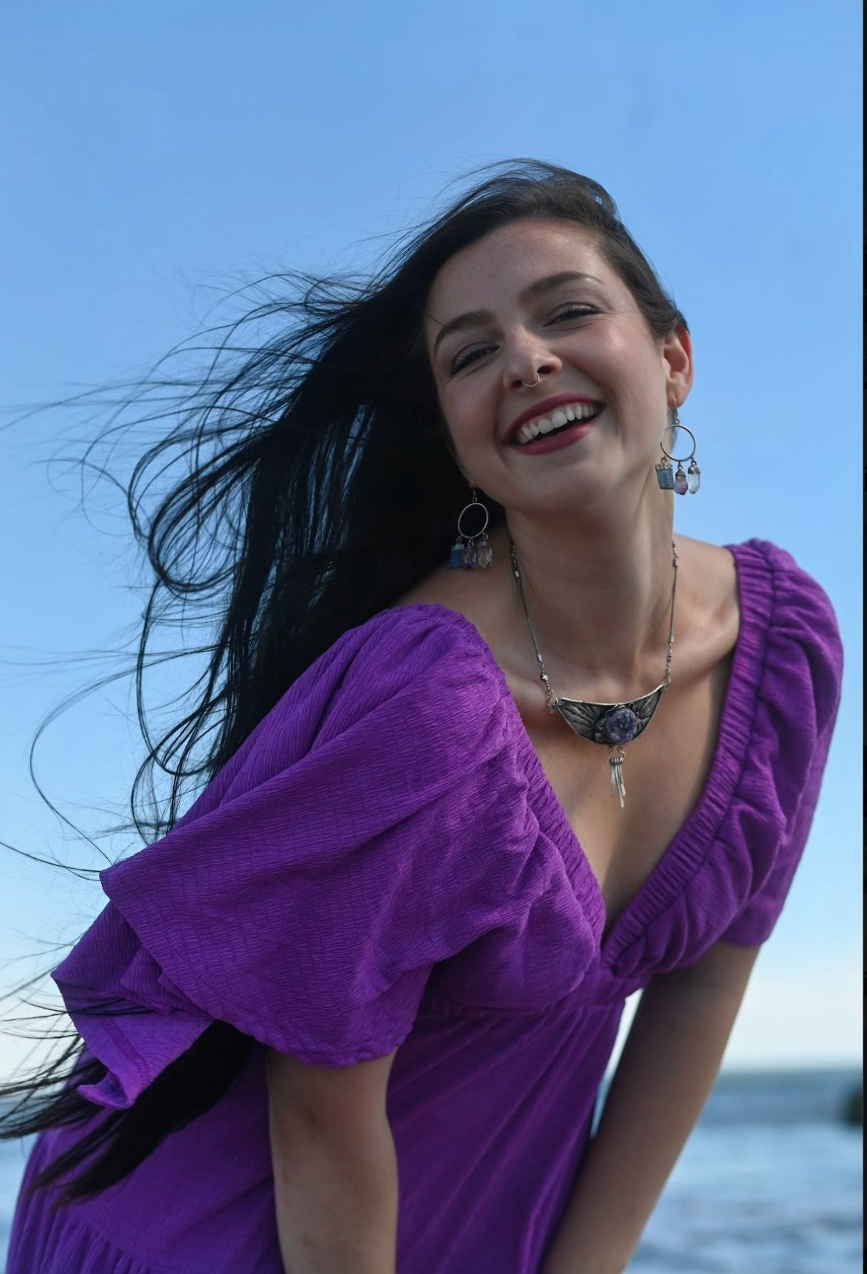 Taylor smiling by the water