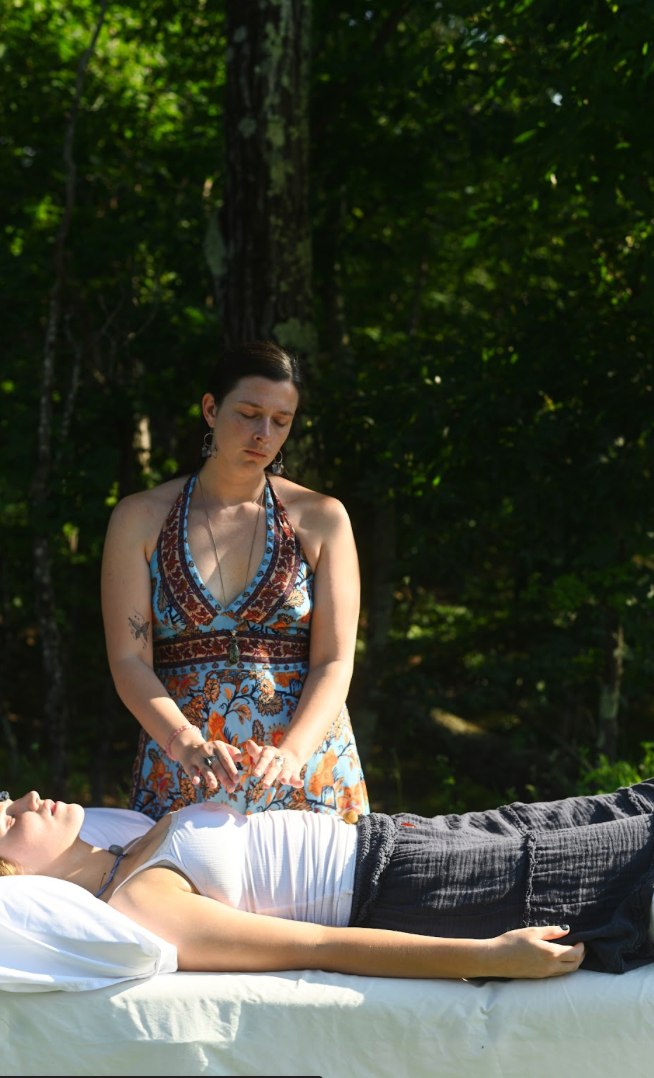 Taylor giving an outdoor Reiki session