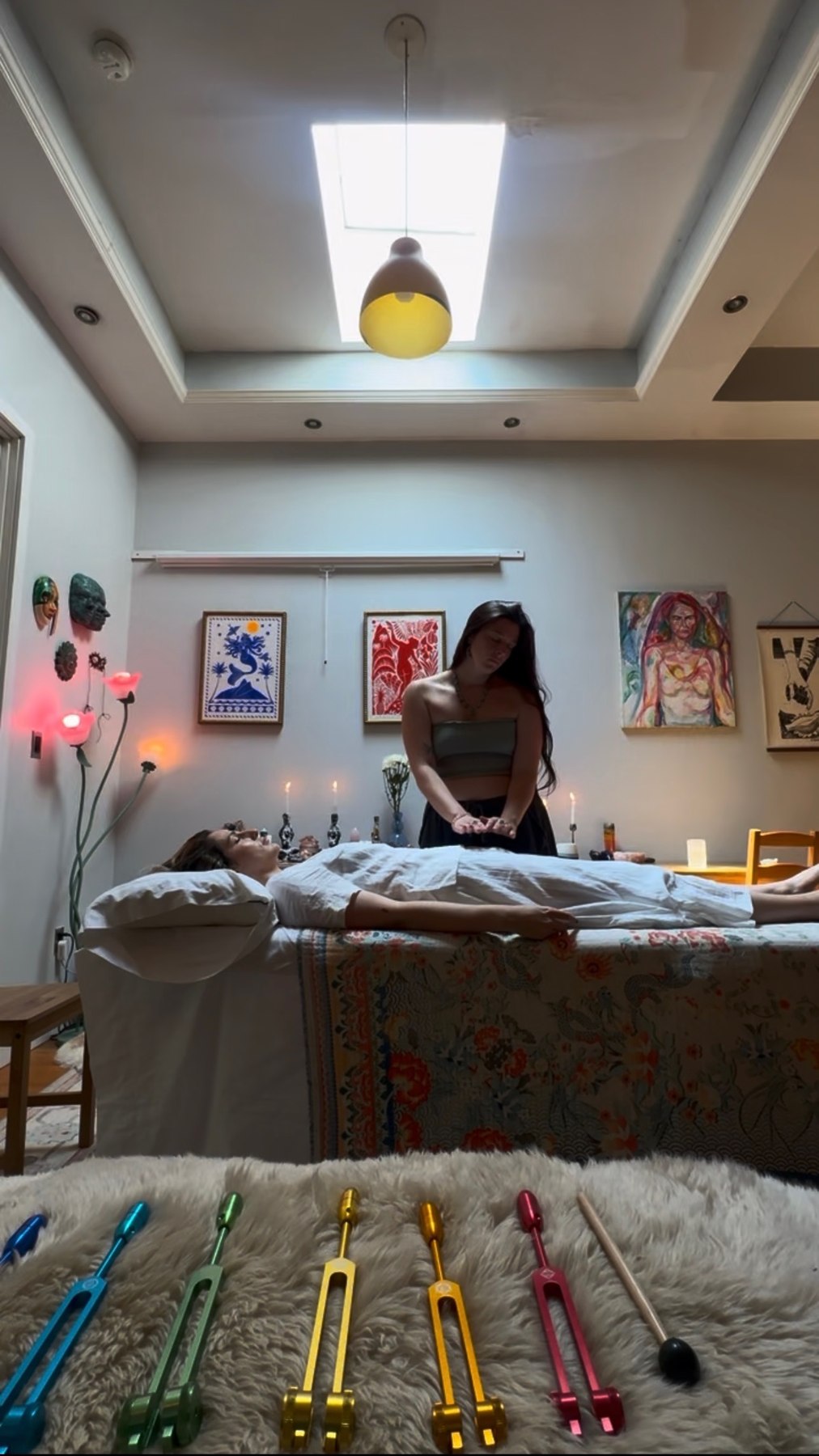 Taylor giving a session with sound healing tools